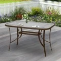 Metallic garden table with tempered glass in brown color 120x70x72cm.