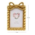 GOLD RESIN PHOTO FRAME WITH TWISTED ROPE AND BOW 10X15CM