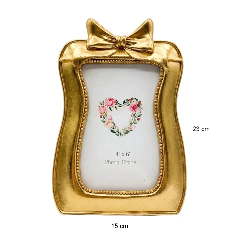 GOLD RESIN BOW PHOTO FRAME 10X15CM